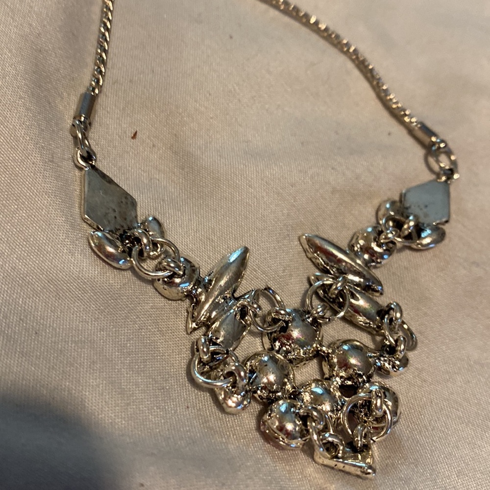 16” silver plated chain holds this awesome bib. $15.00 - Picture 4 of 4